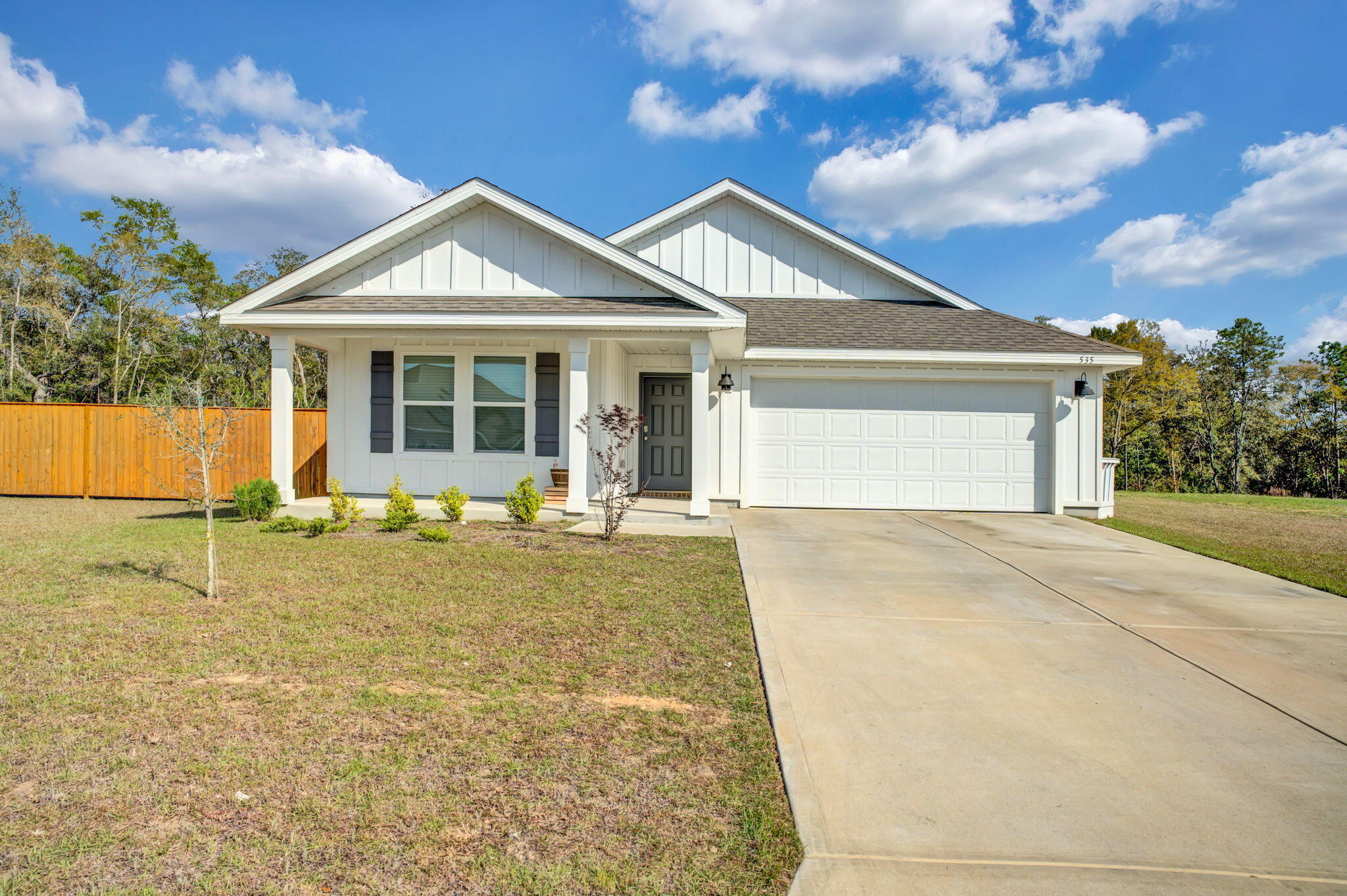 front view of a house with a yard
