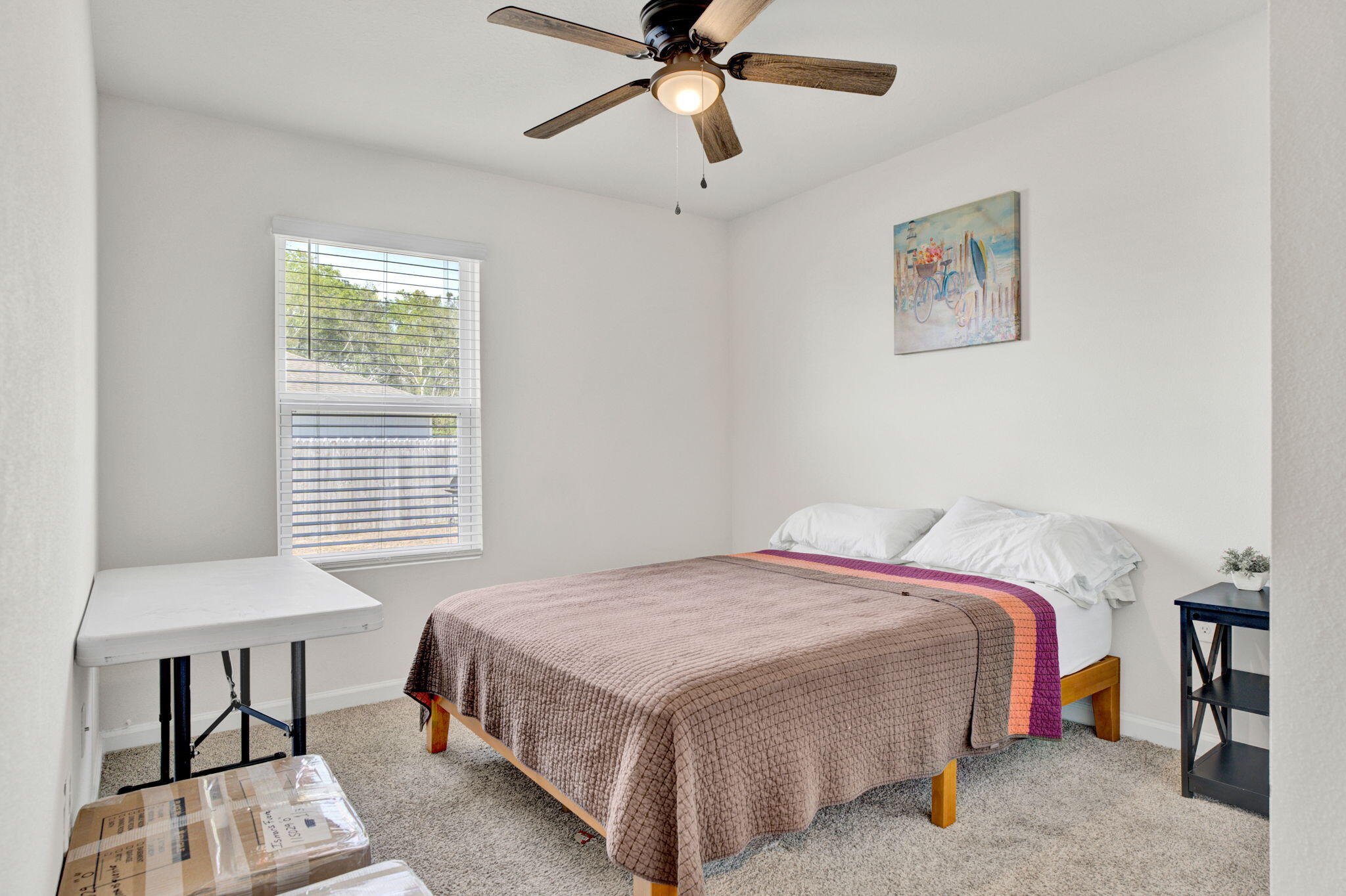 535 Mary Lou Way Crestview, FL 32539 - Photo 13 of 37 a bedroom with a bed and a table