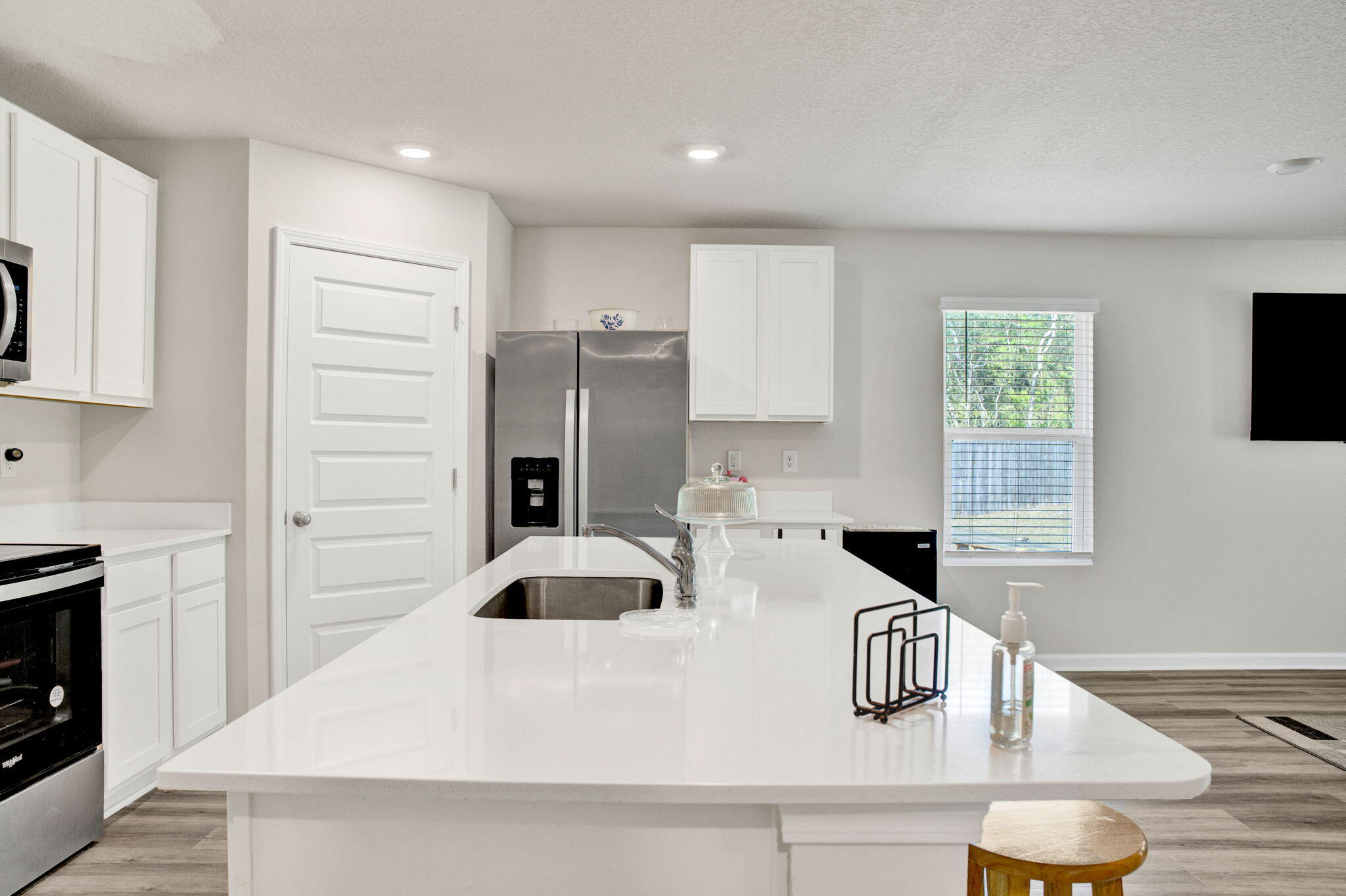 535 Mary Lou Way Crestview, FL 32539 - Photo 14 of 37 a kitchen with a refrigerator and a stove top oven