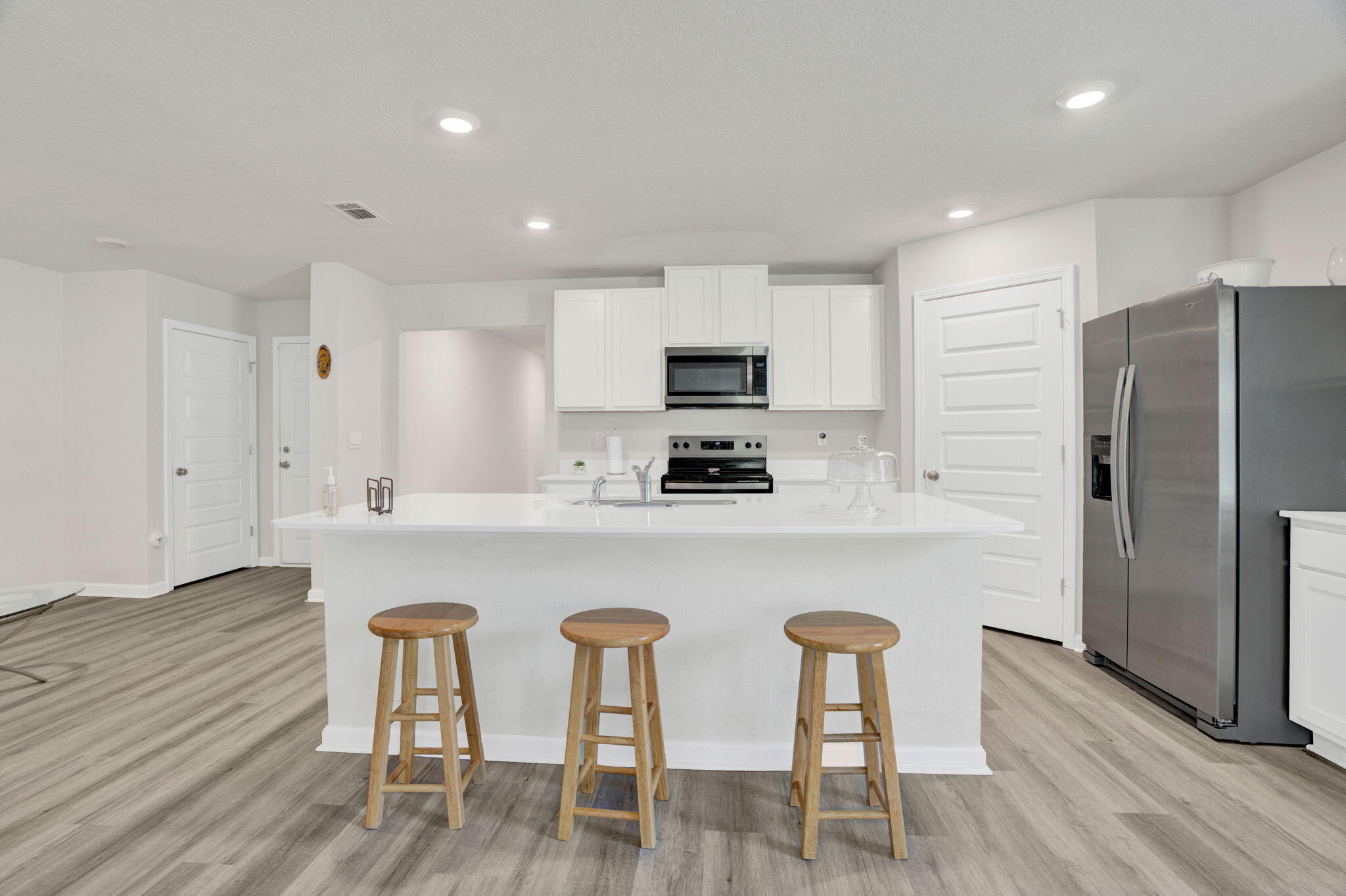 535 Mary Lou Way Crestview, FL 32539 - Photo 15 of 37 a kitchen with stainless steel appliances granite countertop a white table and chairs