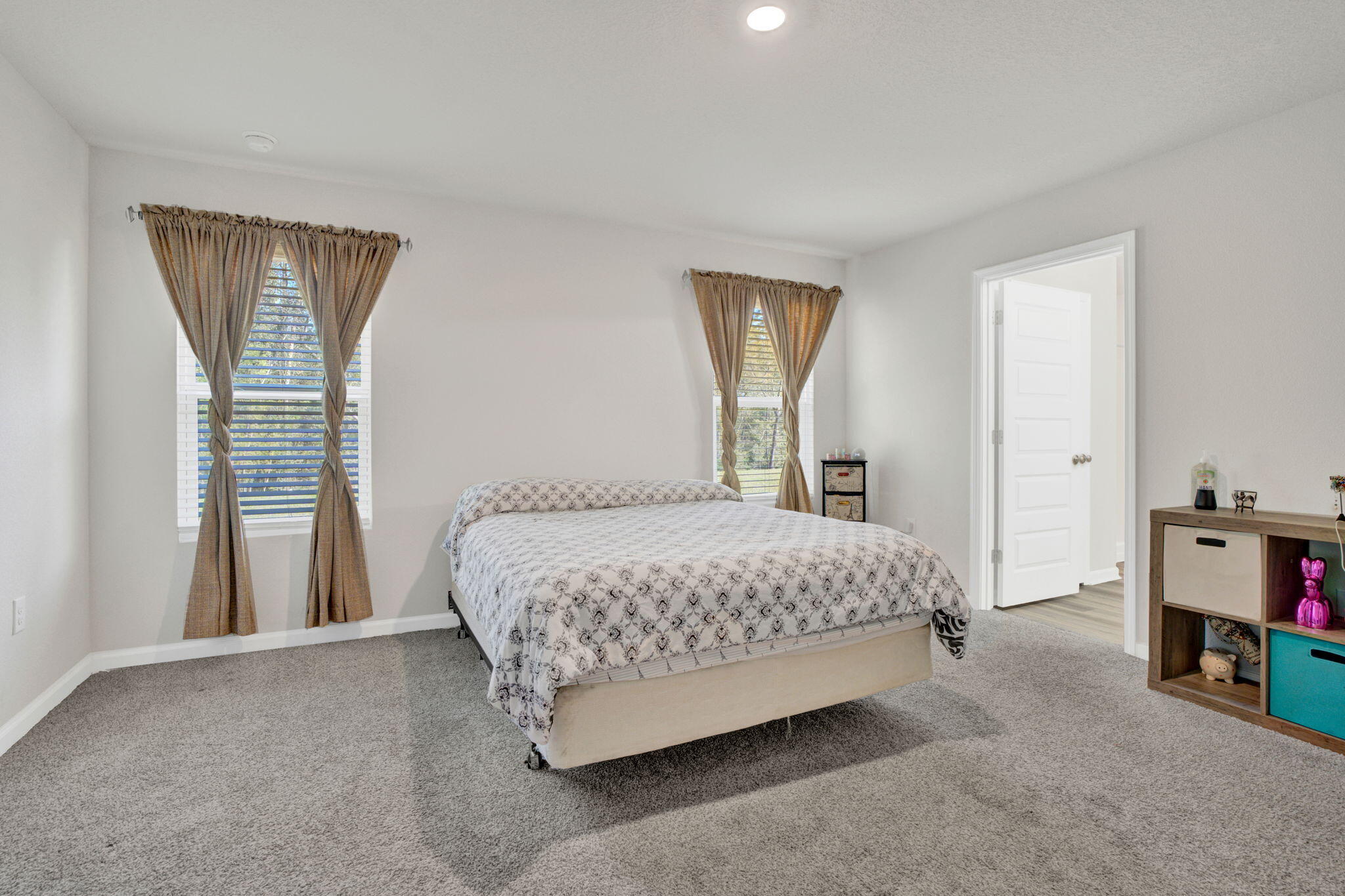535 Mary Lou Way Crestview, FL 32539 - Photo 26 of 37 a bedroom with a bed and a cabinets