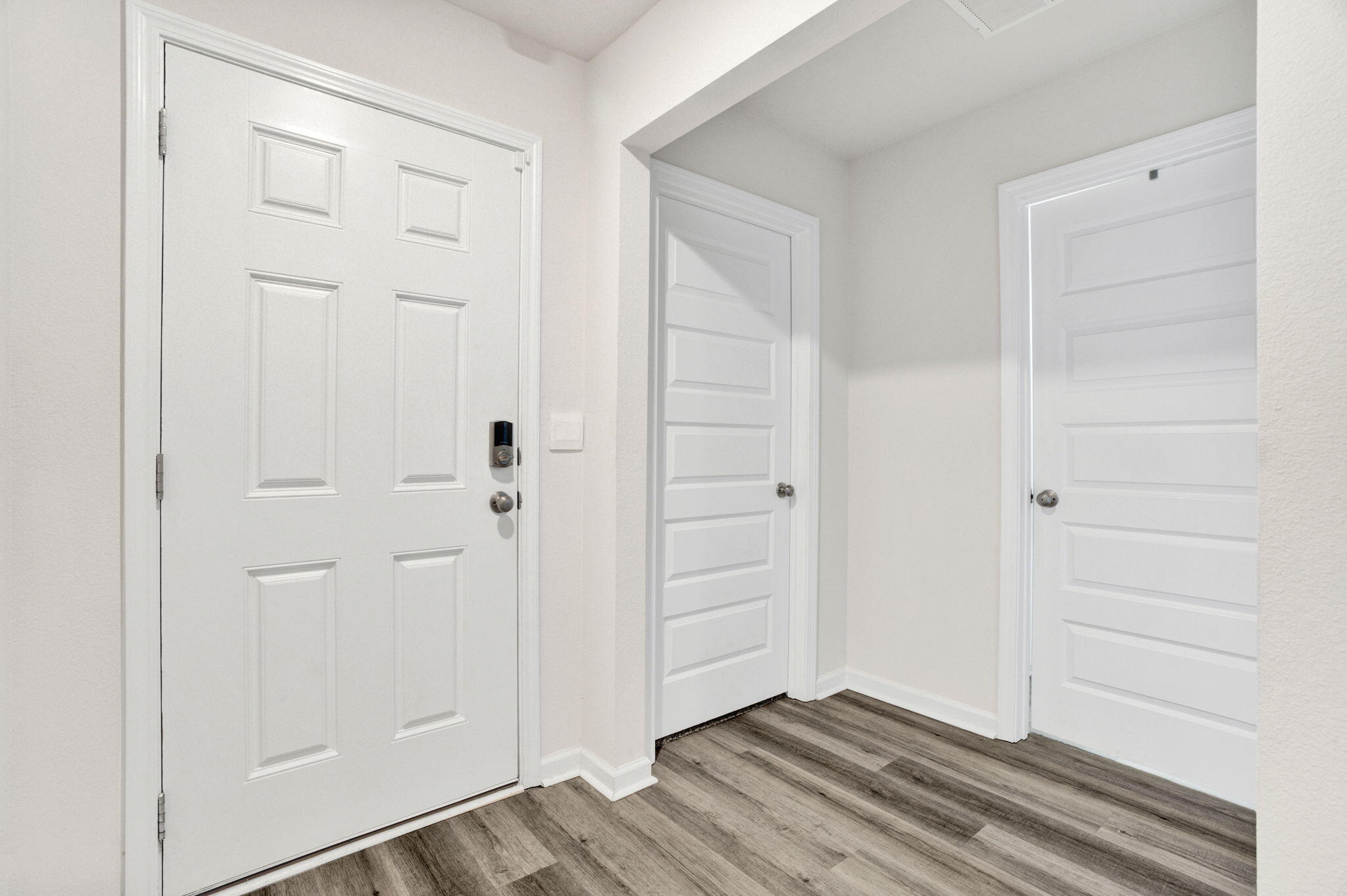 535 Mary Lou Way Crestview, FL 32539 - Photo 8 of 37 an empty room with wooden floor
