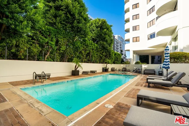 a view of a swimming pool with a patio
