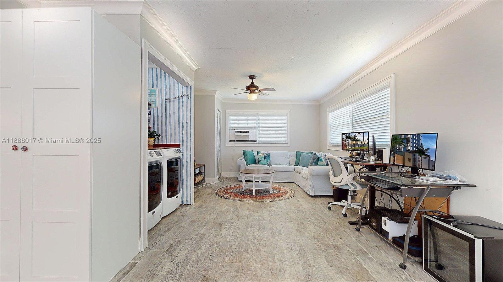 18475 Southwest 204th Street Miami, FL 33187 - Photo 19 of 41 a living room with furniture flat screen tv and a window
