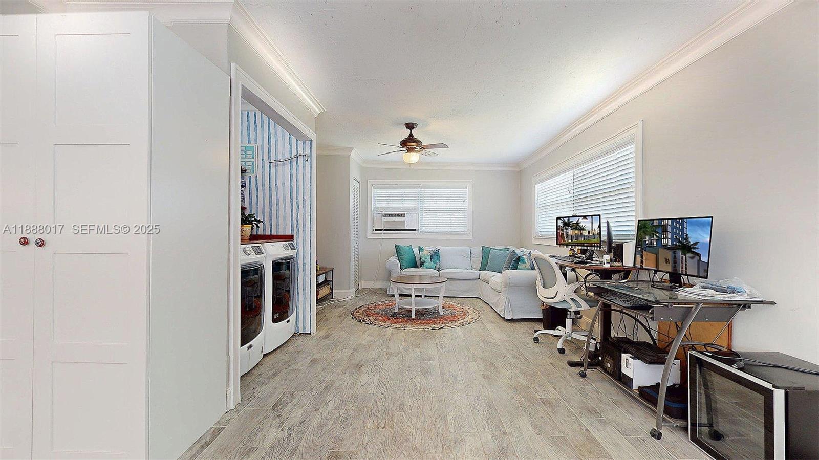 18475 Southwest 204th Street Miami, FL 33187 - Photo 19 of 41 a living room with furniture flat screen tv and a window
