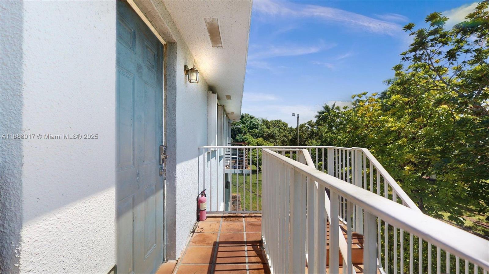 18475 Southwest 204th Street Miami, FL 33187 - Photo 22 of 41 a view of balcony with wooden floor and fence