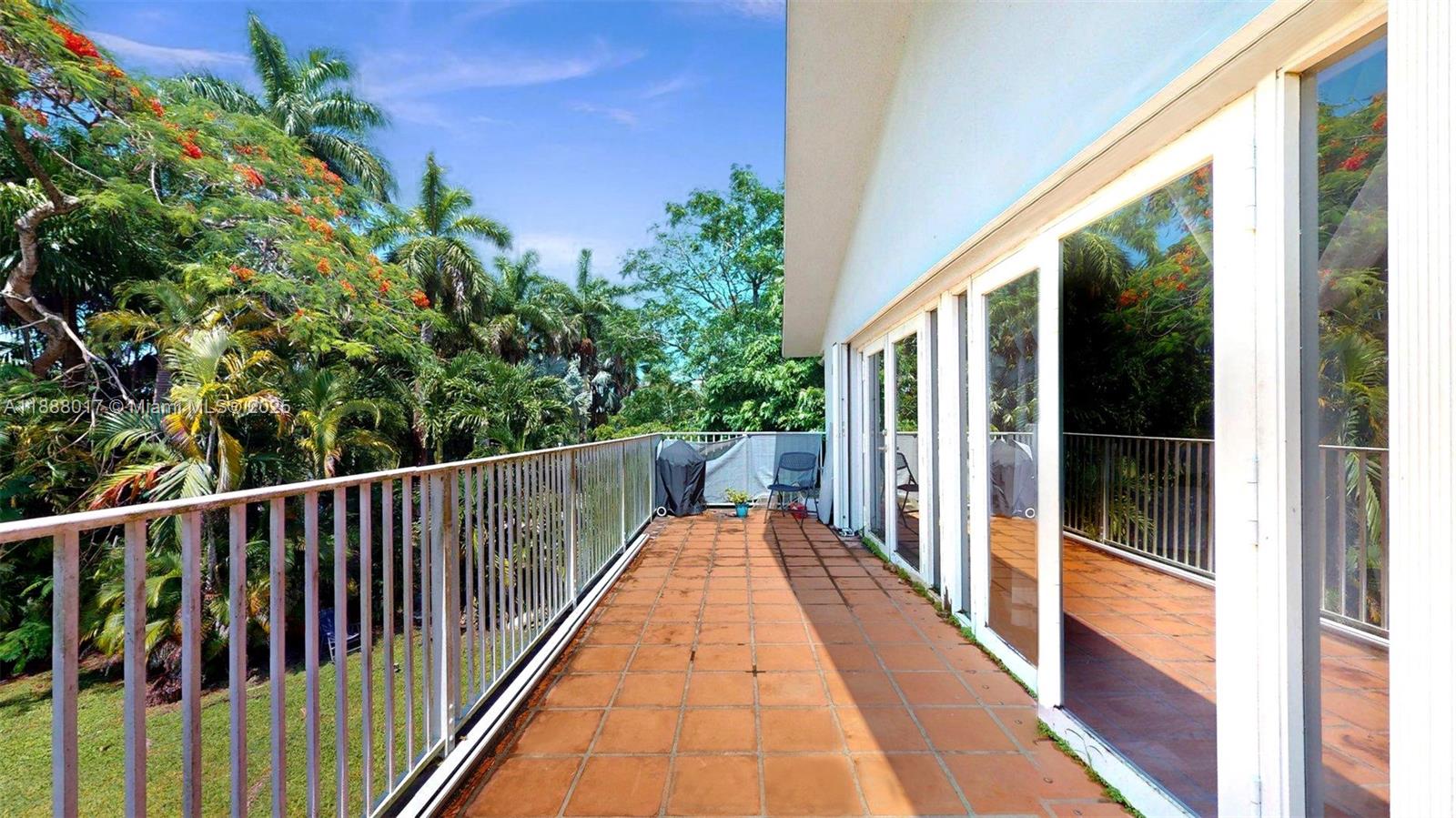 18475 Southwest 204th Street Miami, FL 33187 - Photo 23 of 41 a view of balcony with wooden floor and fence