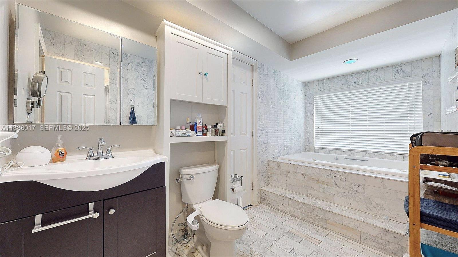 18475 Southwest 204th Street Miami, FL 33187 - Photo 25 of 41 a bathroom with a sink toilet and shower