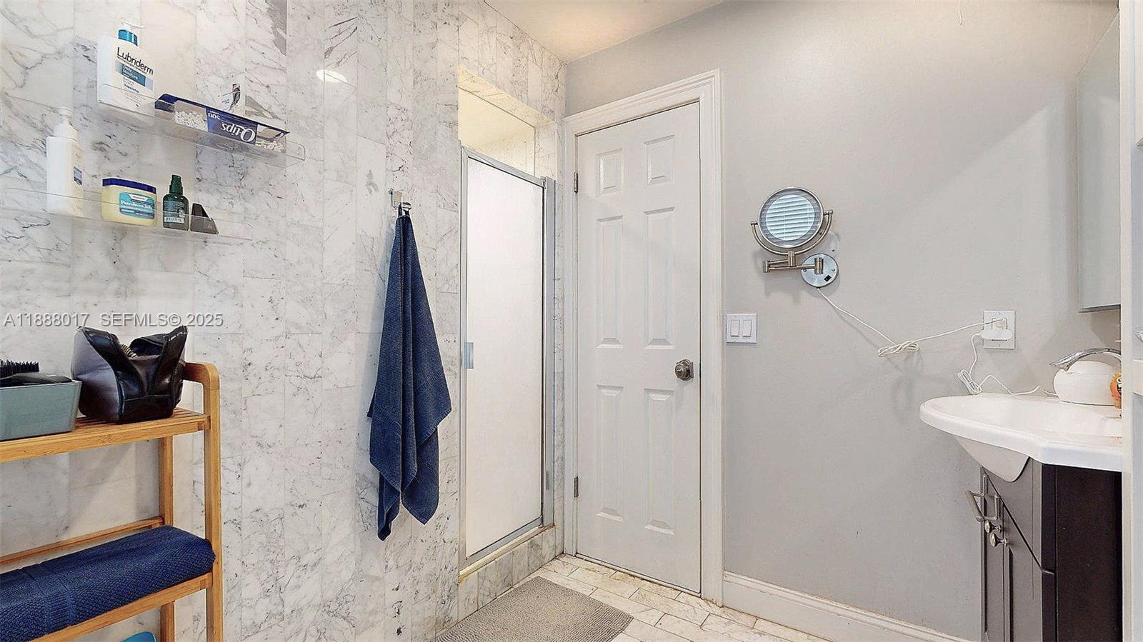 18475 Southwest 204th Street Miami, FL 33187 - Photo 26 of 41 a bathroom with a sink and a mirror