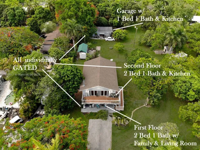 a front view of a house with a garden and trees