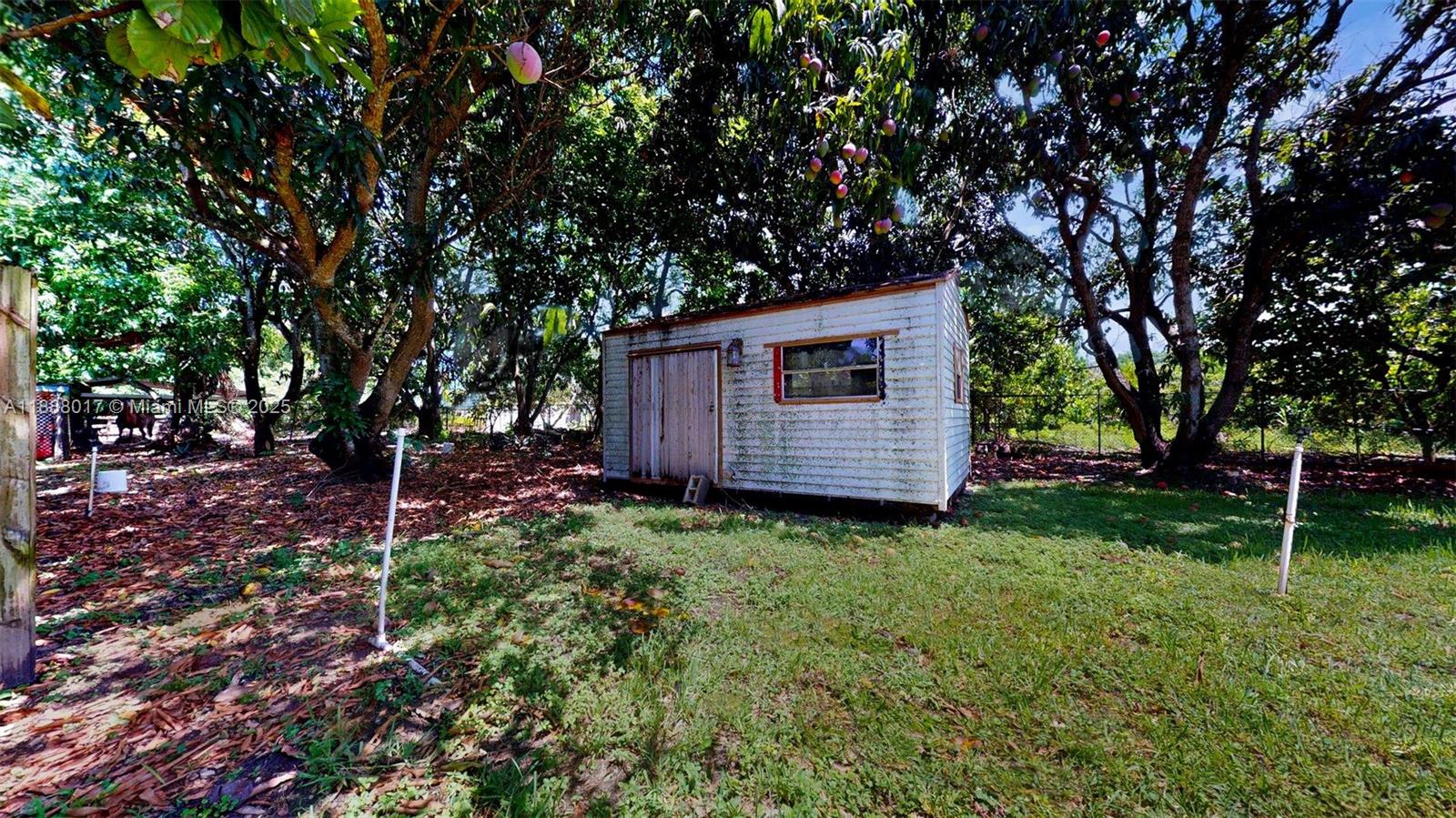 18475 Southwest 204th Street Miami, FL 33187 - Photo 31 of 41 a view of backyard with green space