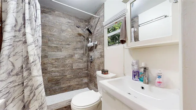 a bedroom with a bed and a table in it