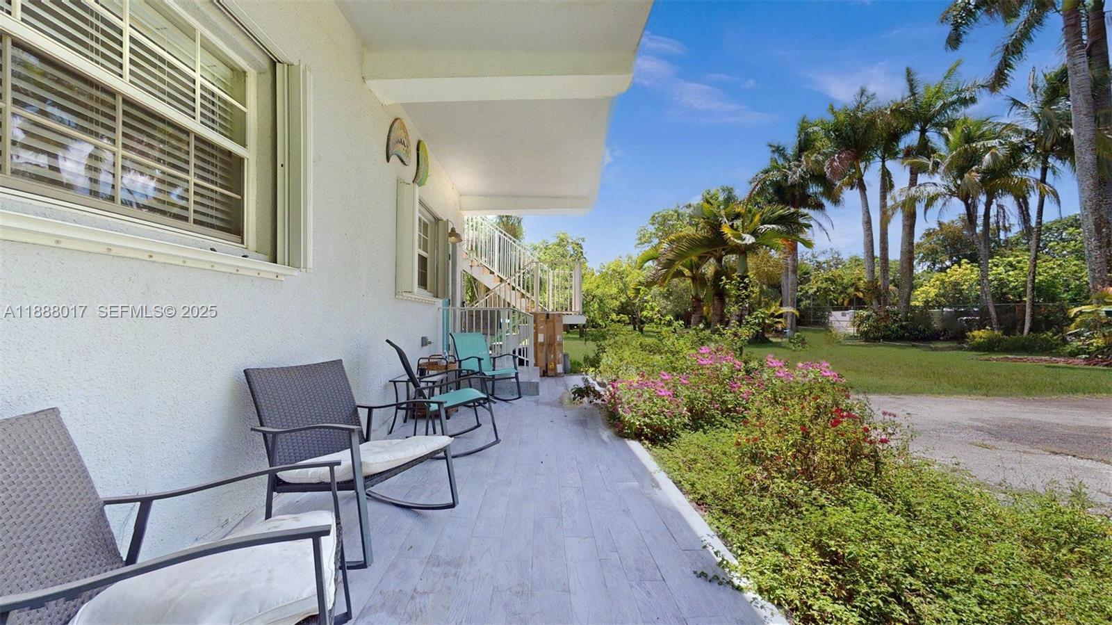 18475 Southwest 204th Street Miami, FL 33187 - Photo 7 of 41 a backyard of a house with table and chairs