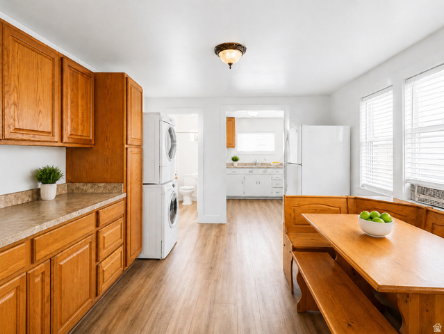 69 South Main Street Manti, UT 84642 - Photo 15 of 44 Kitchen area featuring wood-finish flooring, light wood cabinetry, and a patterned laminate countertop