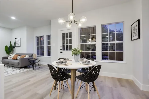 a view of a dining room with furniture and window