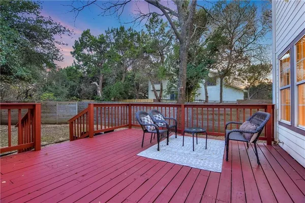a view of deck with table and chairs and wooden floor