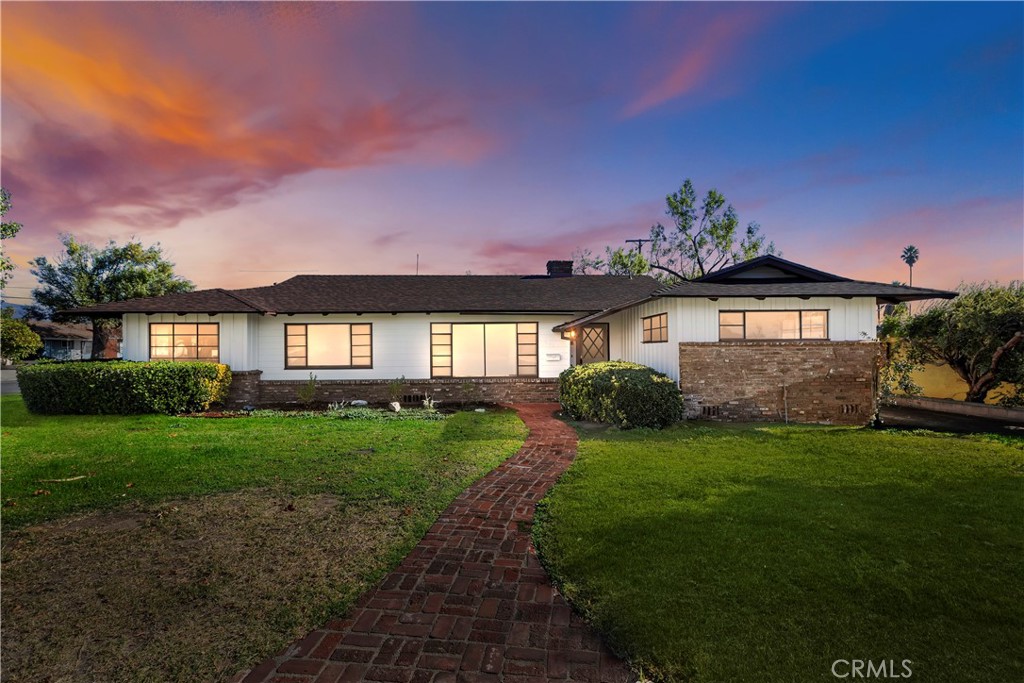 731 North Riverside Avenue Rialto, CA 92376 - Photo 1 of 1 a front view of a house with a yard