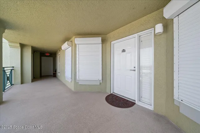 a view of a room with an entryway and closet area