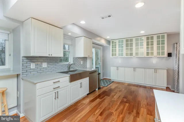 a kitchen with a refrigerator stove and a sink
