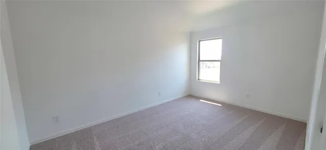 an empty room that has a window