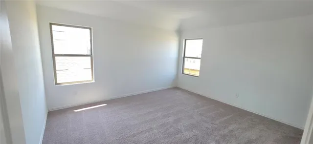 an empty room that has a window