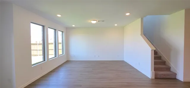 a view of entryway with wooden floor and stairs