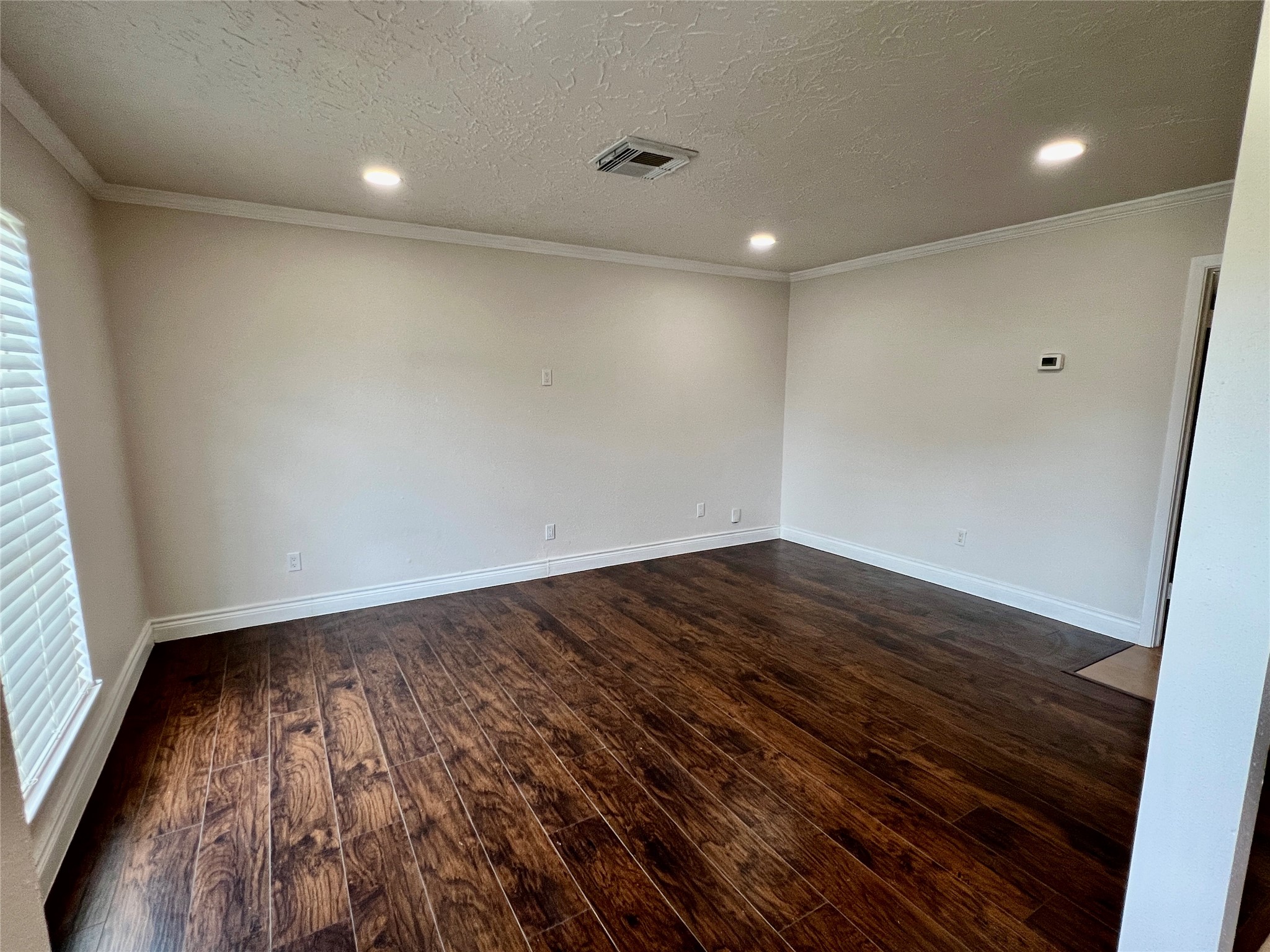 12110 Murr Way Houston, TX 77048 - Photo 4 of 24 a view of room with wooden floor and fan