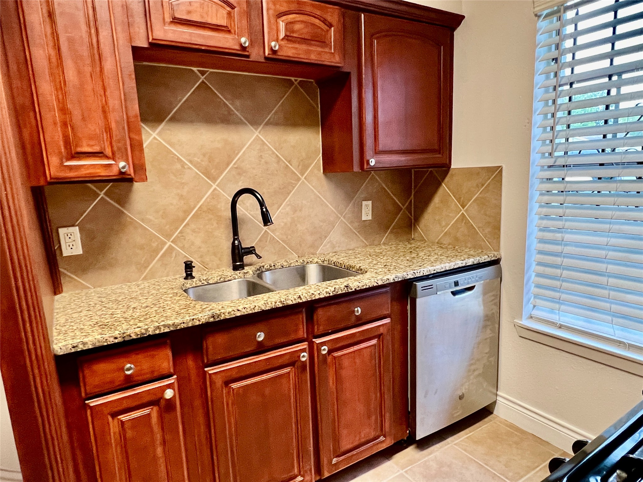 12110 Murr Way Houston, TX 77048 - Photo 7 of 24 a sink with granite countertop a sink