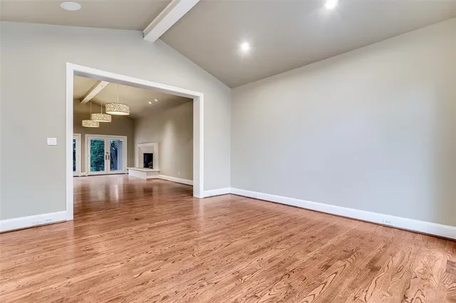 an empty room with wooden floor