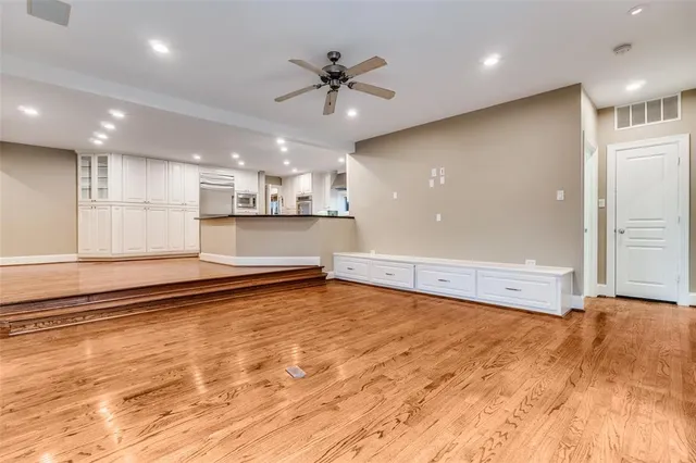 a view of a kitchen with a stove and a sink cabinets