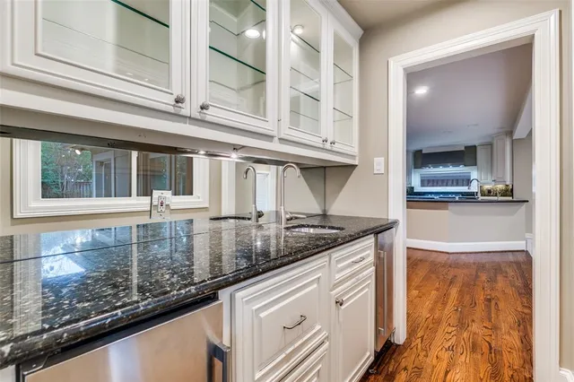 a kitchen with stainless steel appliances granite countertop a sink and a counter space