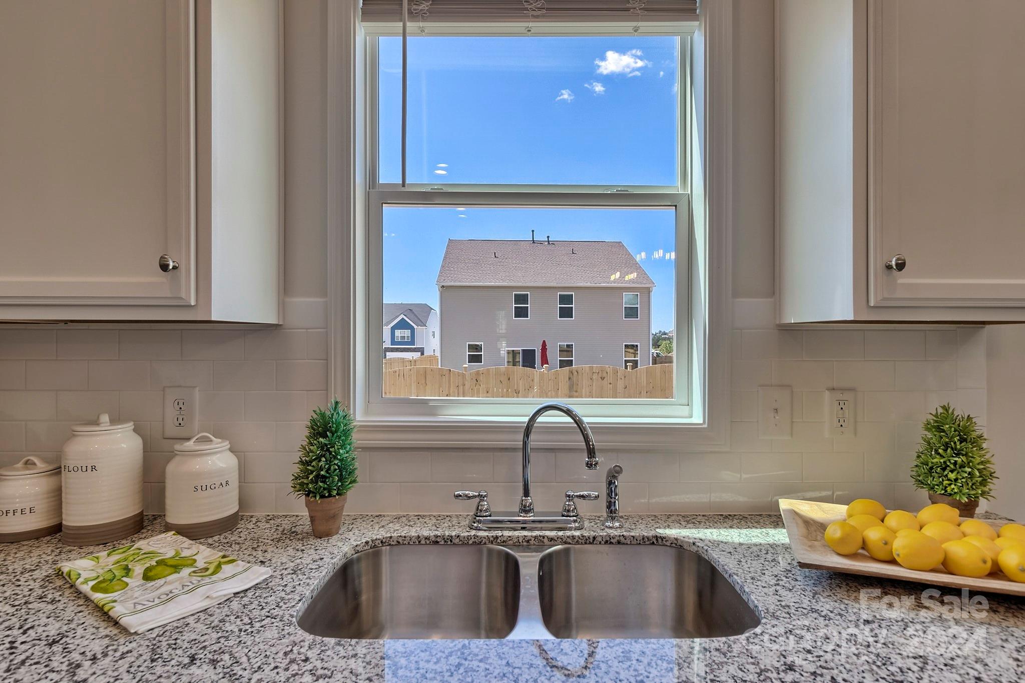 6504 Alanbrook Road, Unit 63 Charlotte, NC 28215 - Photo 12 of 25 a kitchen with a sink and a stove top oven
