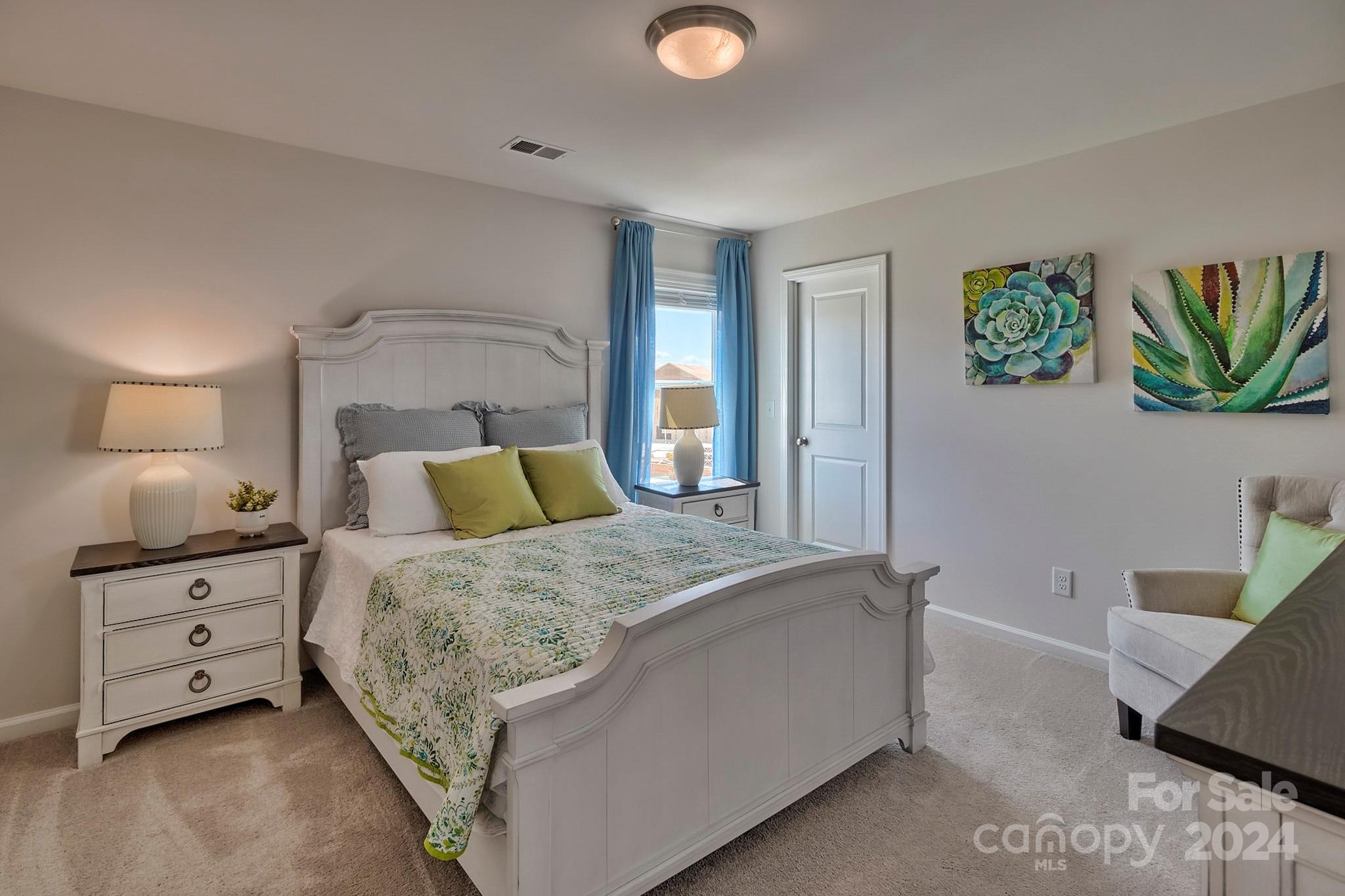 6504 Alanbrook Road, Unit 63 Charlotte, NC 28215 - Photo 17 of 25 a bedroom with a bed and a lamp