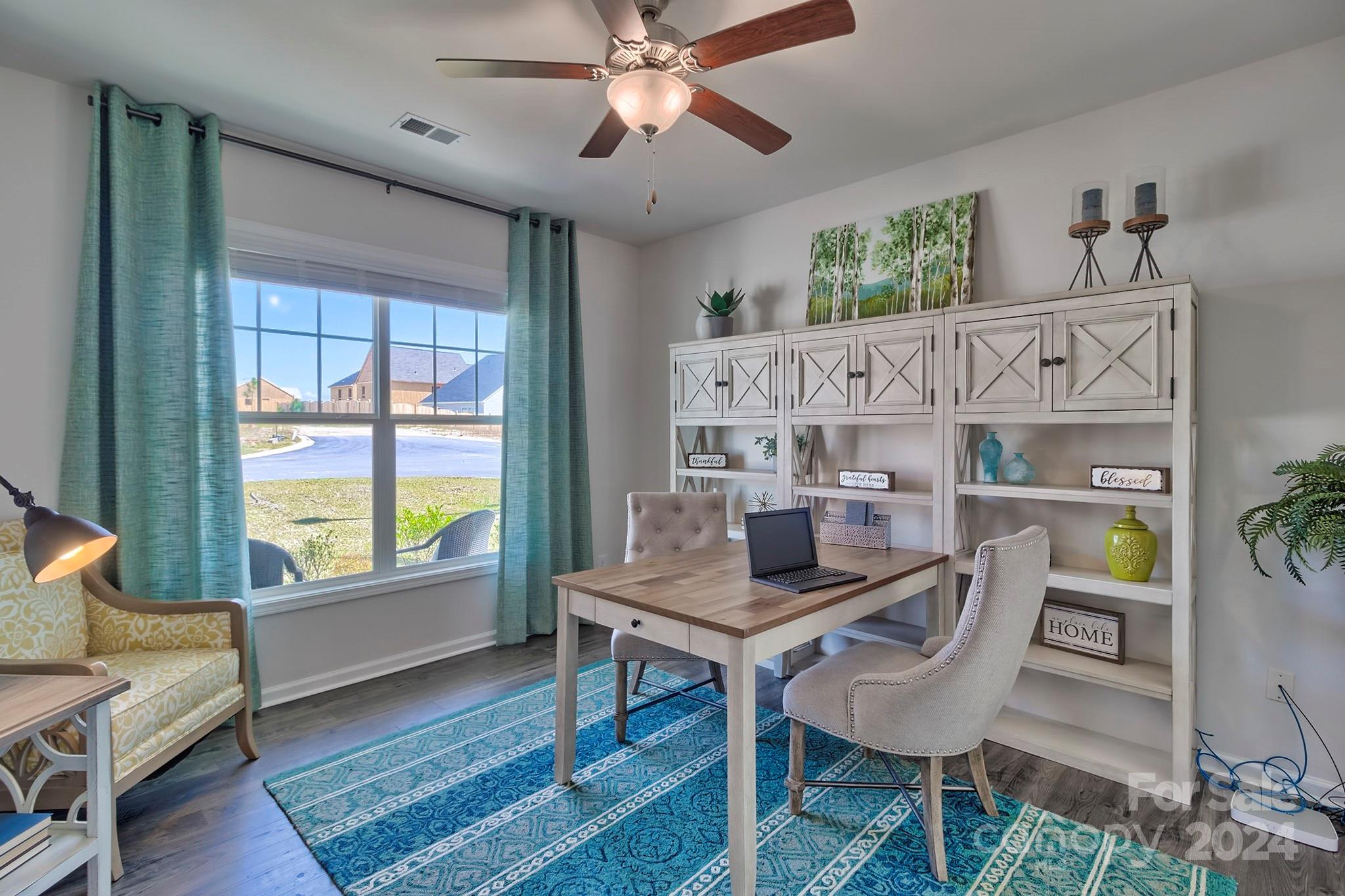 6504 Alanbrook Road, Unit 63 Charlotte, NC 28215 - Photo 23 of 25 a living room with furniture and a window