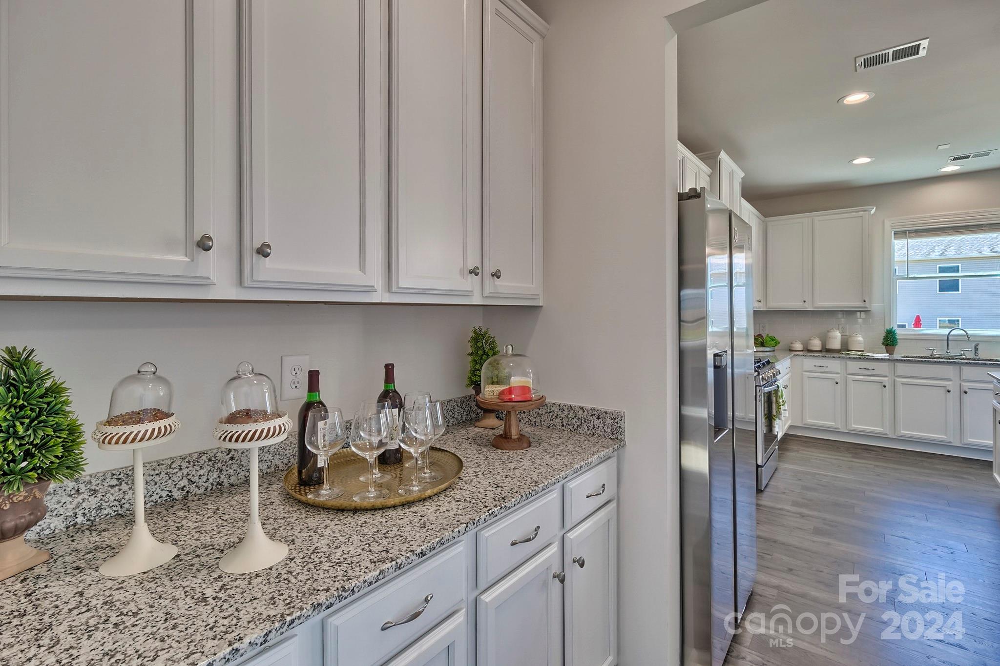 6504 Alanbrook Road, Unit 63 Charlotte, NC 28215 - Photo 8 of 25 a kitchen with a sink and cabinets