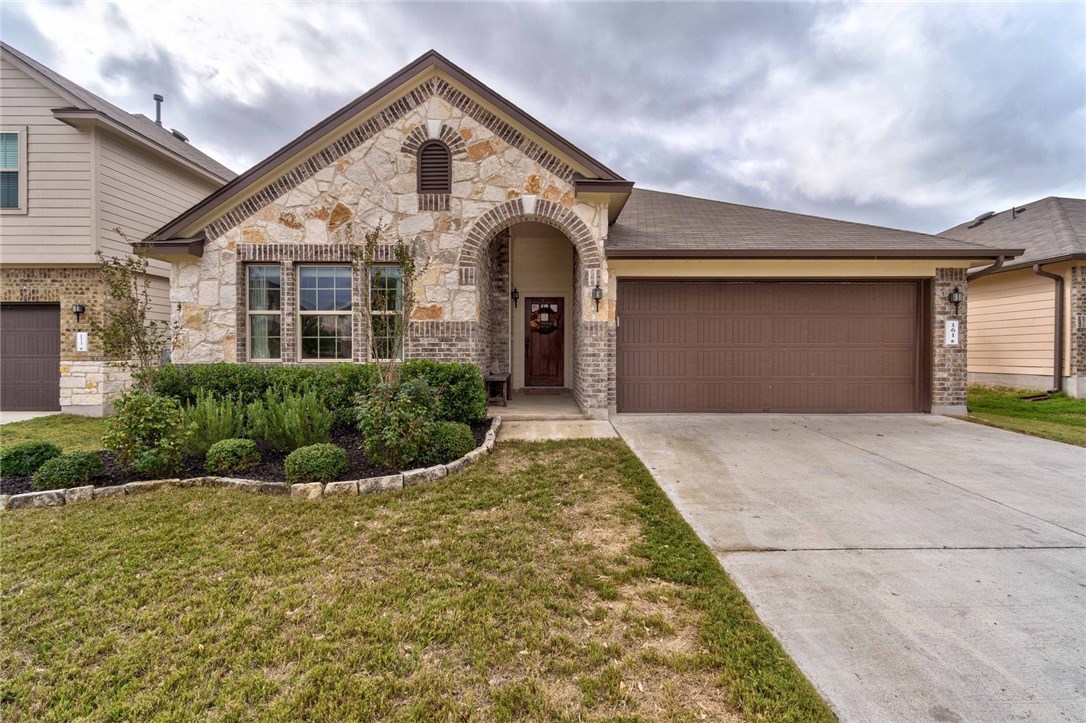 161 Beargrass Drive Kyle, TX 78640 - Photo 1 of 1 a front view of a house with garden