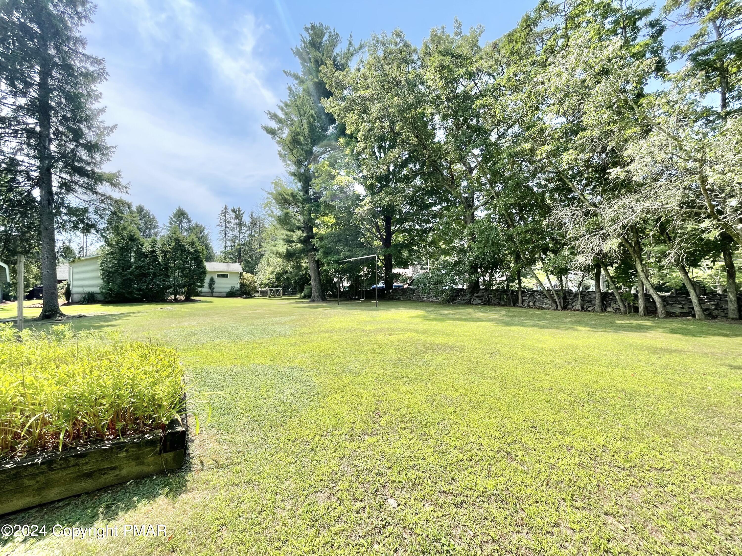 214 Shine Hill Road Henryville, PA 18332 - Photo 11 of 126 a view of an outdoor space and swimming pool