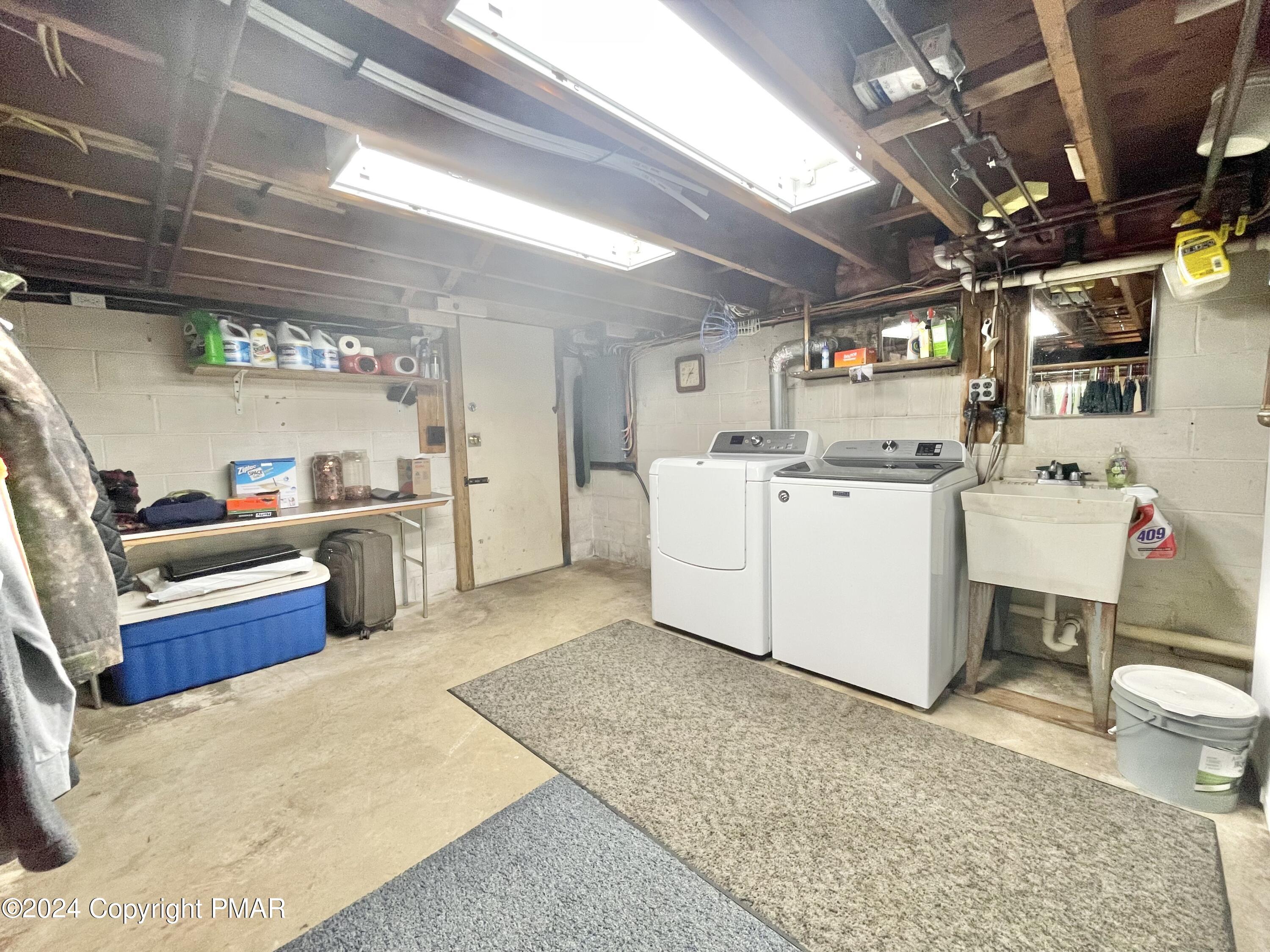 214 Shine Hill Road Henryville, PA 18332 - Photo 120 of 126 a view of a storage & utility room with washer and dryer