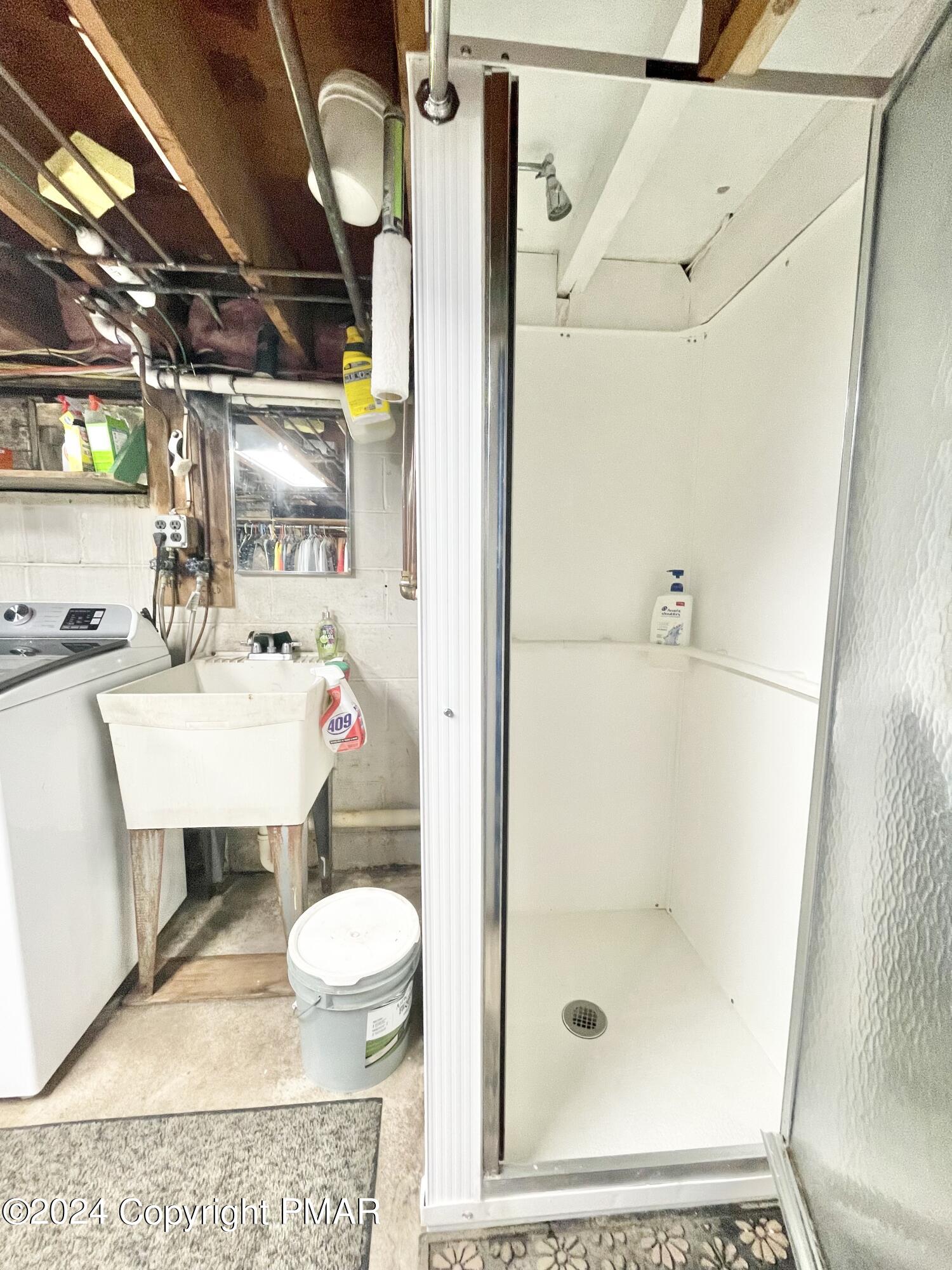 214 Shine Hill Road Henryville, PA 18332 - Photo 121 of 126 a bathroom with a sink mirror toilet and shower