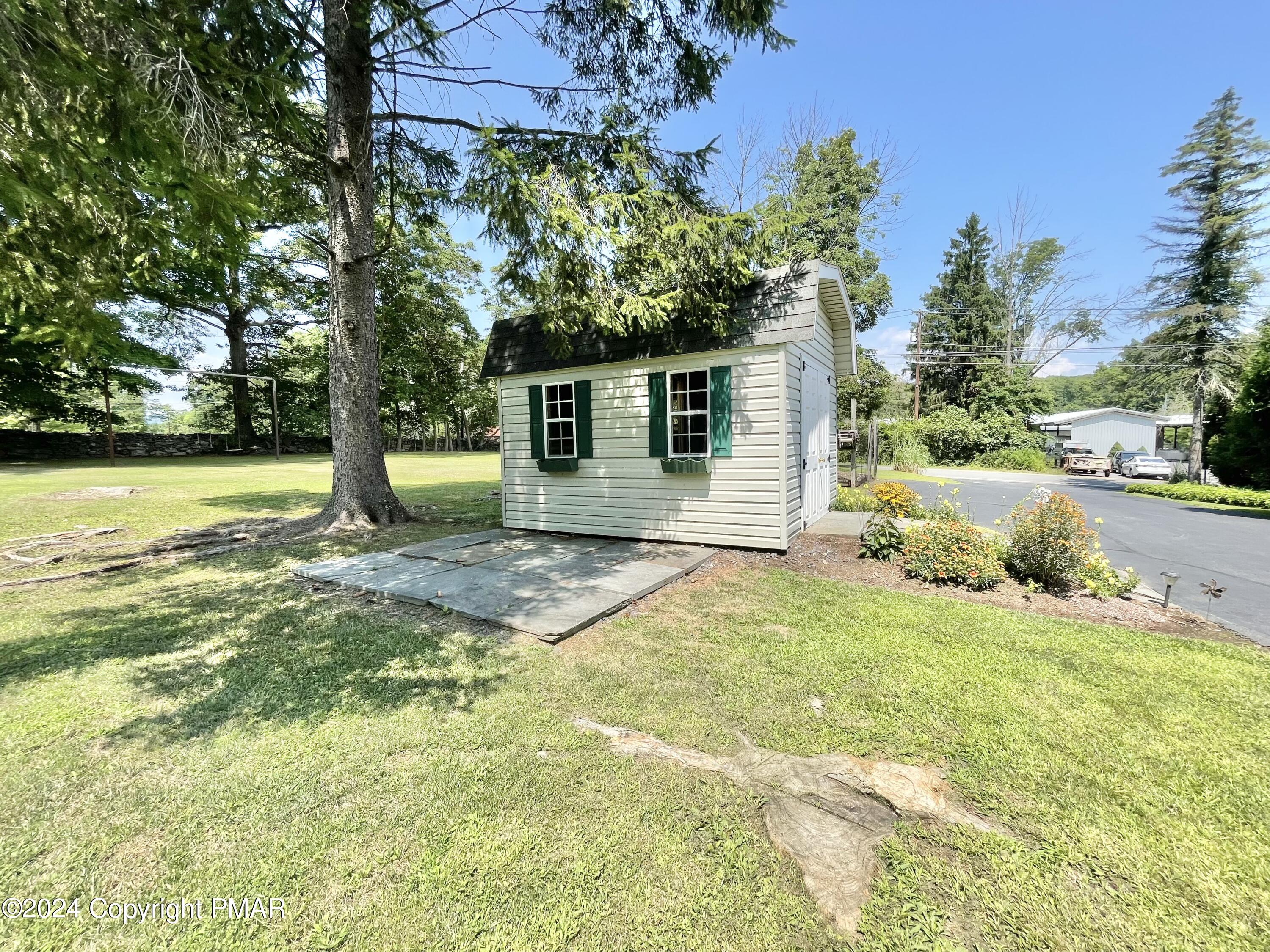 214 Shine Hill Road Henryville, PA 18332 - Photo 17 of 126 a view of a house with a yard and tree s