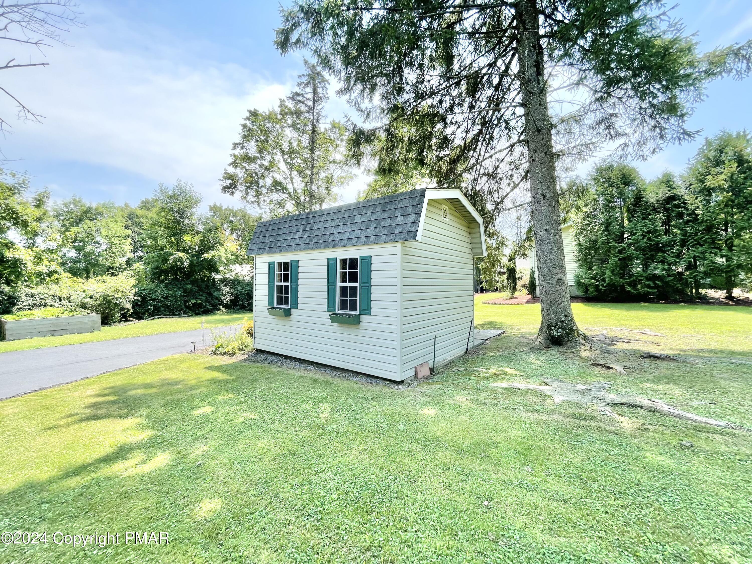 214 Shine Hill Road Henryville, PA 18332 - Photo 18 of 126 a view of a house with a yard