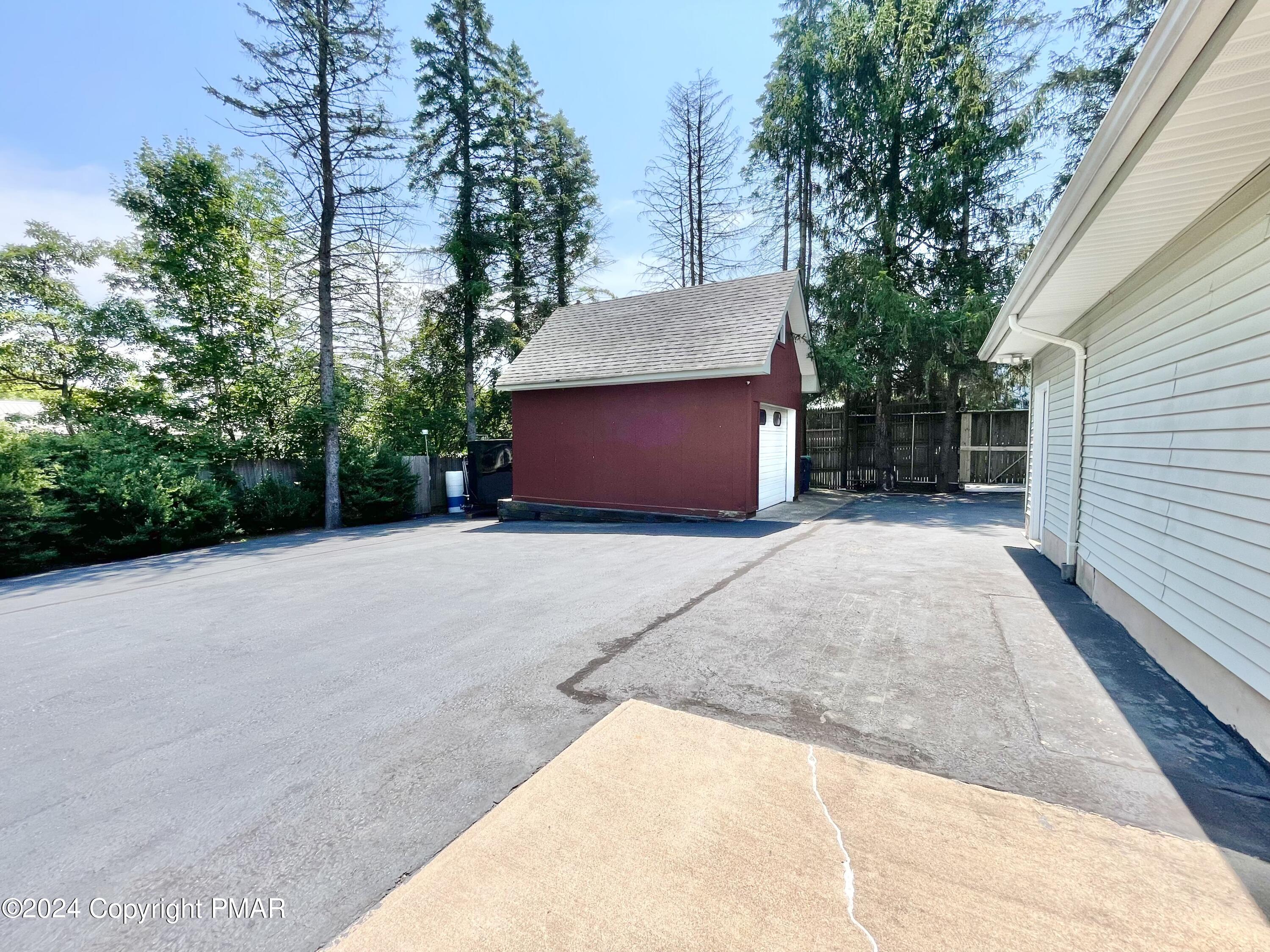 214 Shine Hill Road Henryville, PA 18332 - Photo 35 of 126 a view of a house with a yard and garage