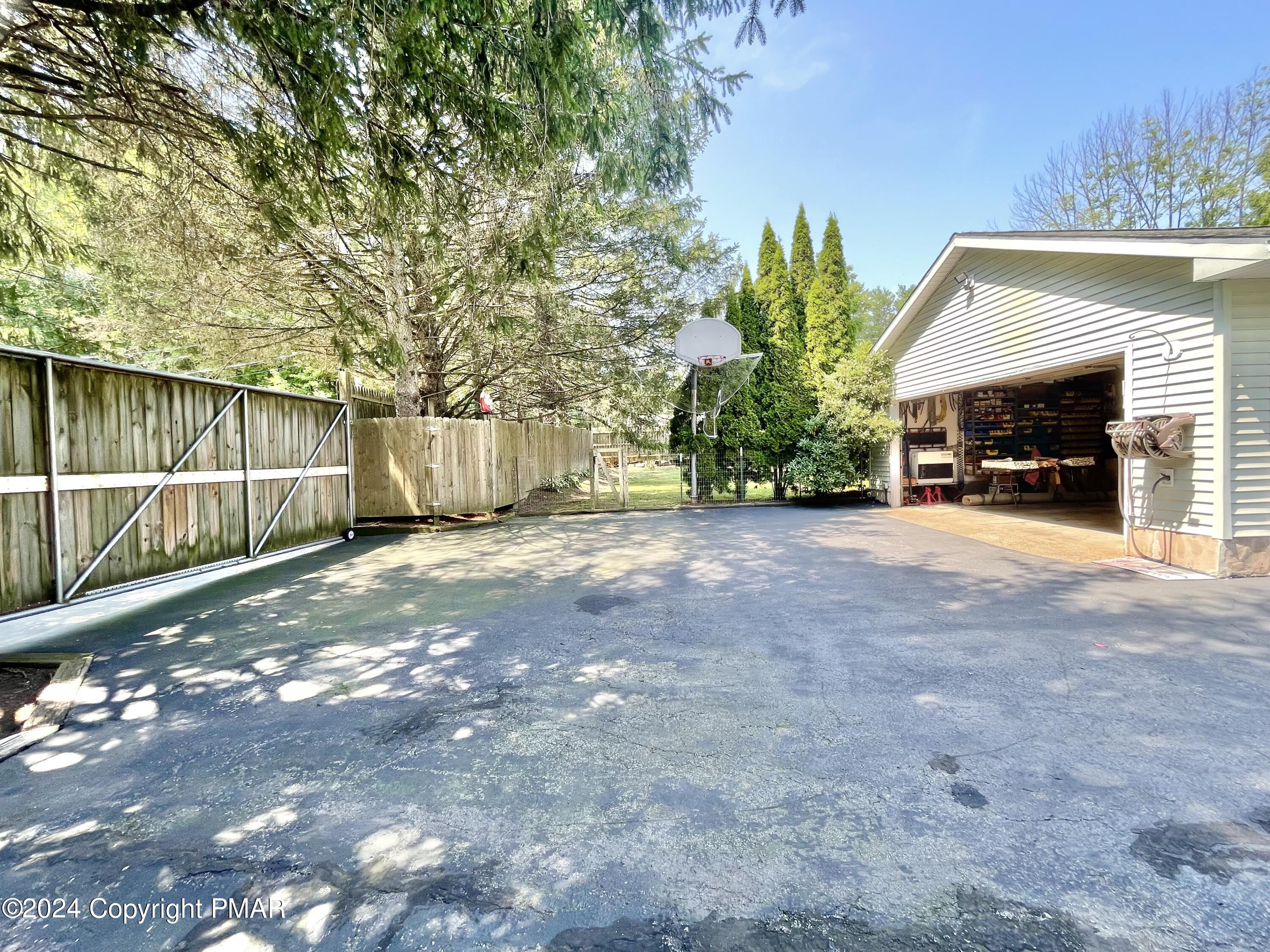 214 Shine Hill Road Henryville, PA 18332 - Photo 40 of 126 Back driveway entrance gate on rollers