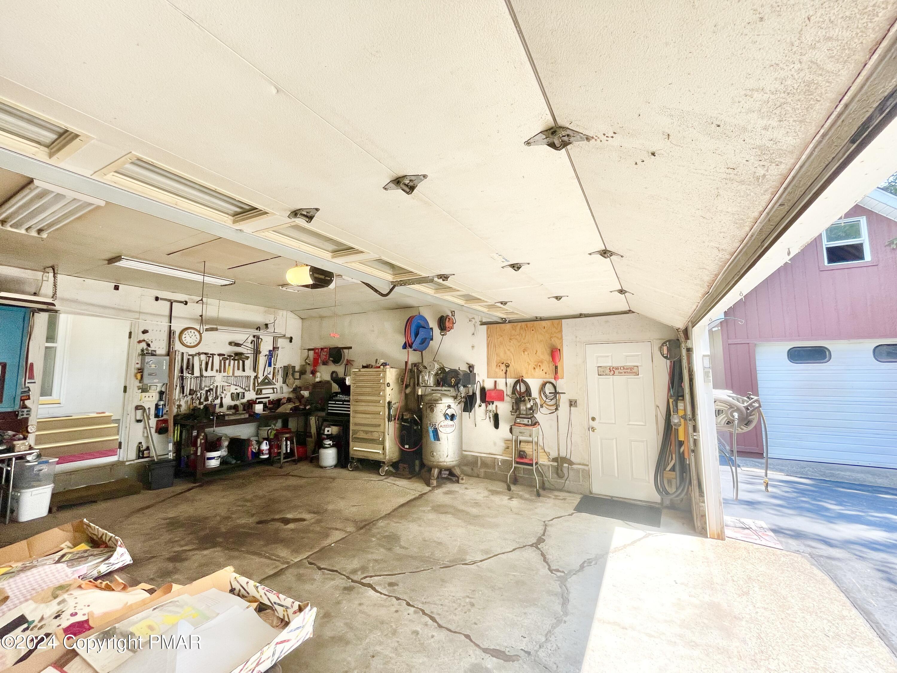 214 Shine Hill Road Henryville, PA 18332 - Photo 42 of 126 a view of a garage with wooden floor