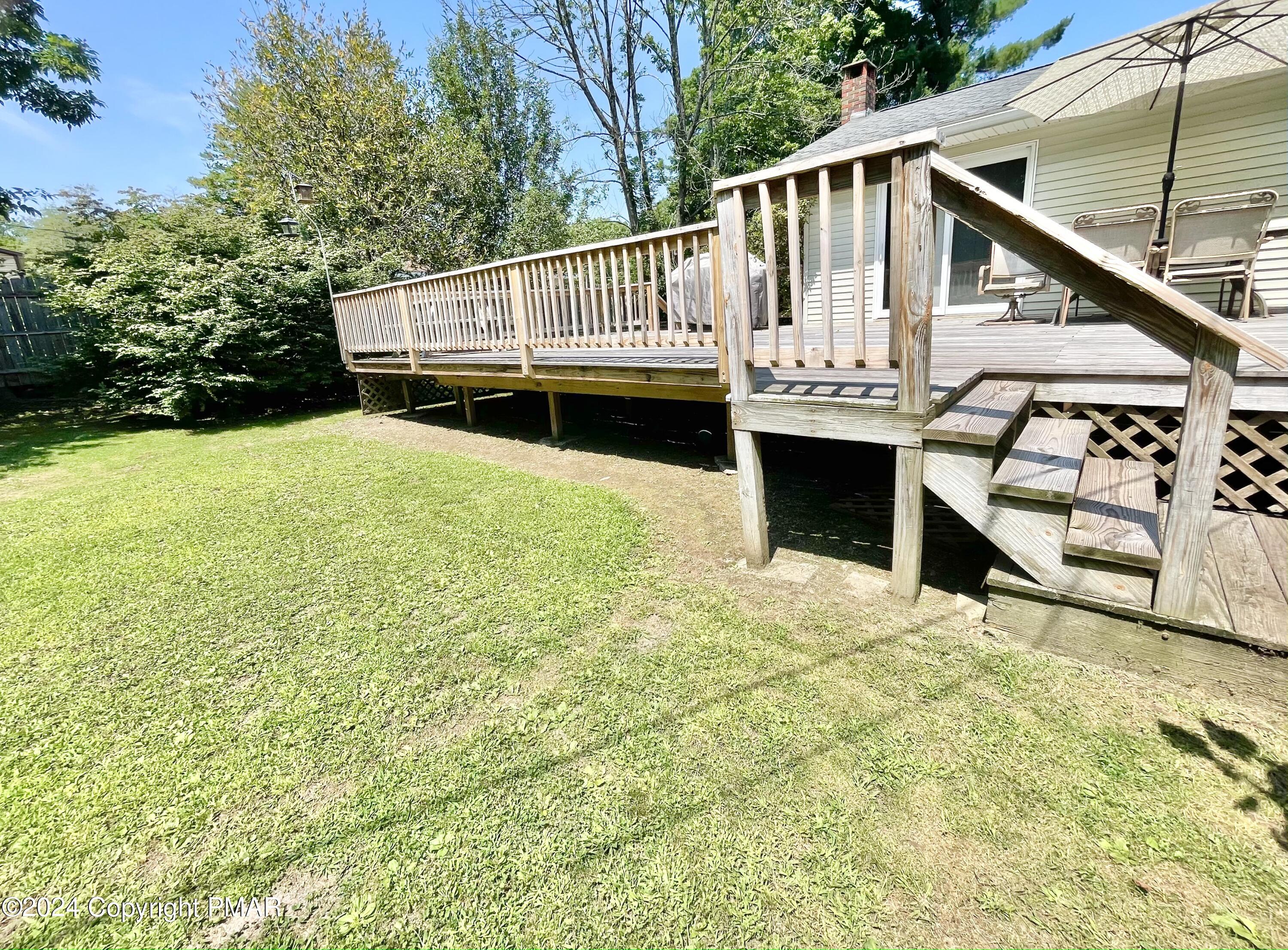 214 Shine Hill Road Henryville, PA 18332 - Photo 64 of 126 a view of a house with wooden stairs and a small yard