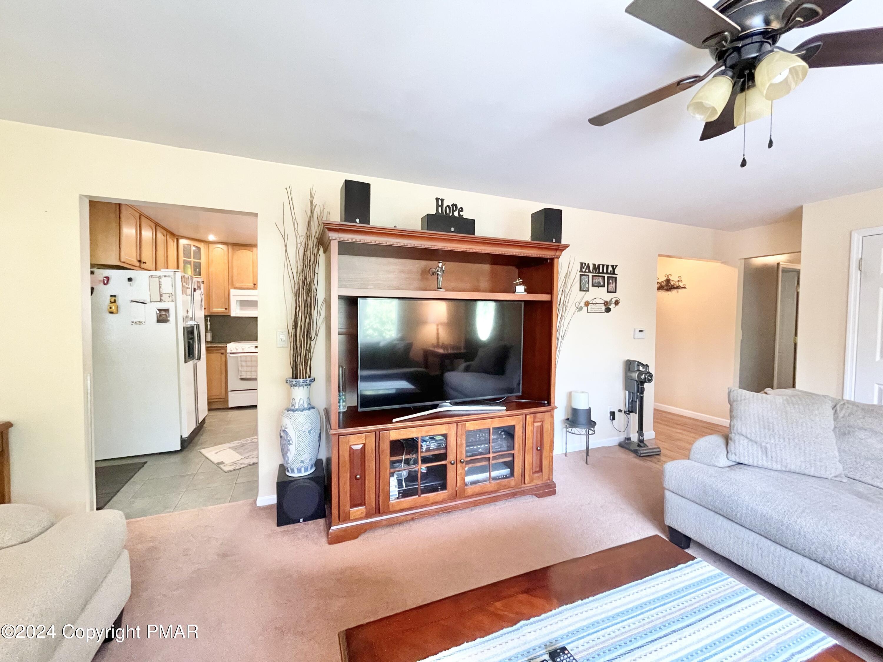214 Shine Hill Road Henryville, PA 18332 - Photo 79 of 126 a living room with furniture and a flat screen tv