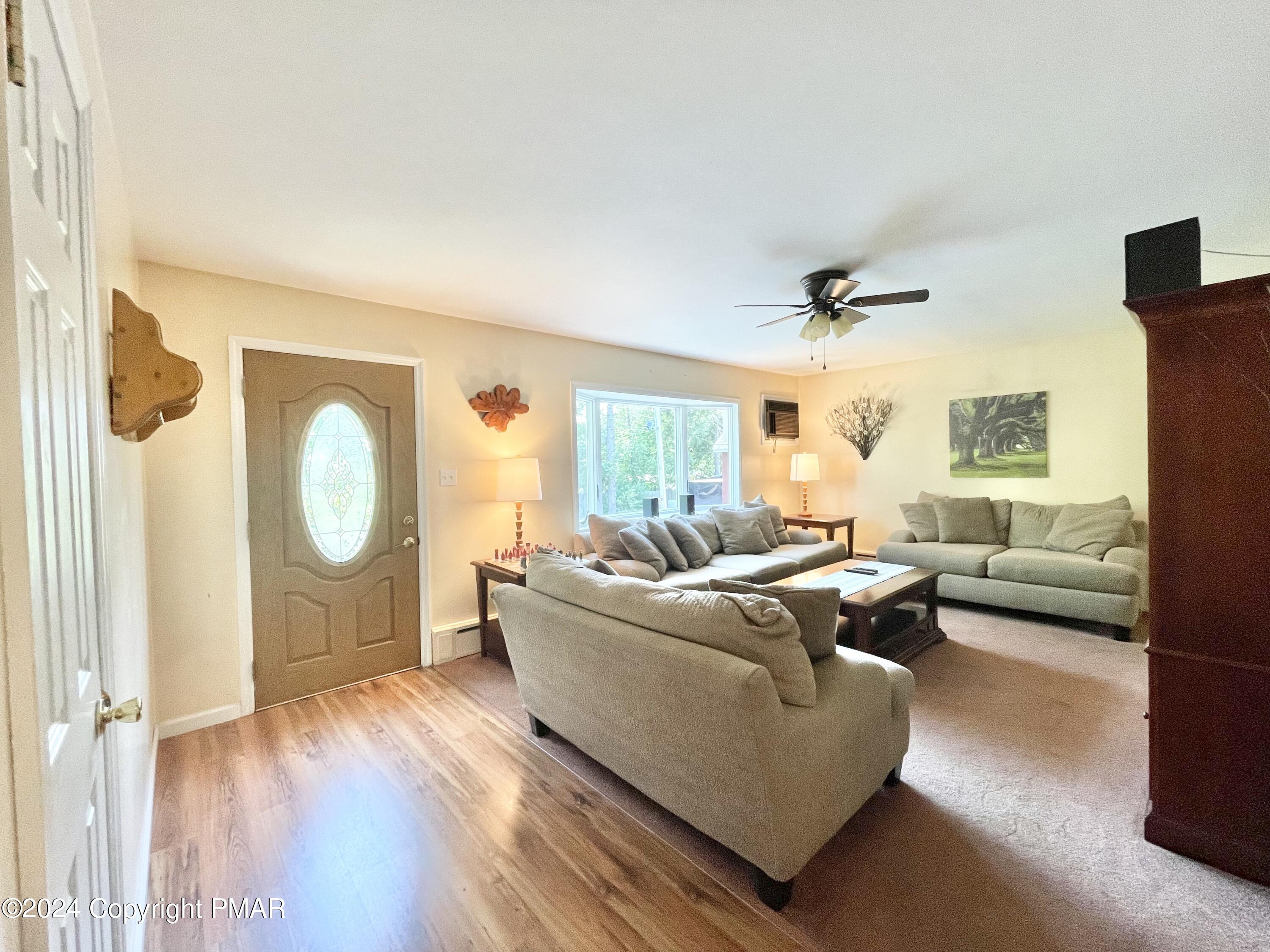 214 Shine Hill Road Henryville, PA 18332 - Photo 81 of 126 a living room with furniture and a window