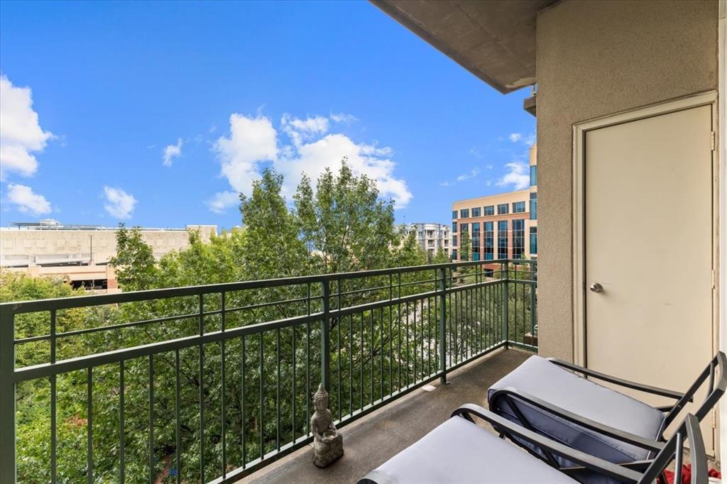 5055 Addison Circle, Unit 427 Addison, TX 75001 - Photo 13 of 35 a view of a balcony with chairs