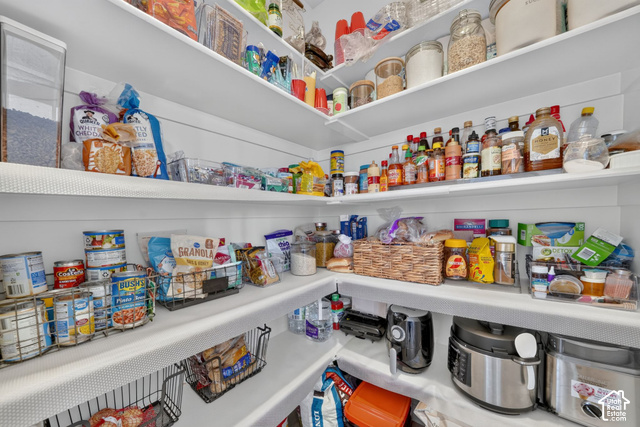 428 Quartz Road Tooele, UT 84074 - Photo 13 of 35 Pantry with Built-in white shelving providing extensive storage, corner configuration maximizing space, and multiple tiers for organization