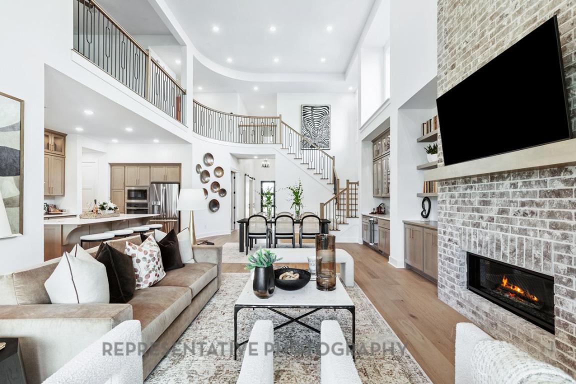 277 Leaning Rock Ridge Austin, TX 78737 - Photo 6 of 9 a living room with furniture a flat screen tv and a fireplace